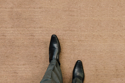 Walking wearing formal wear in the carpet