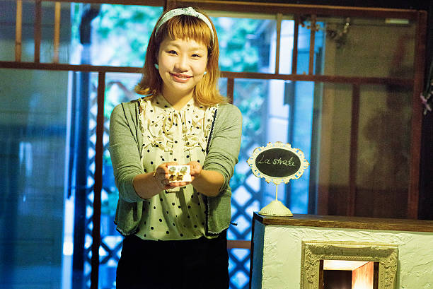Trendy young nostalgia shop owner shows off earings pair