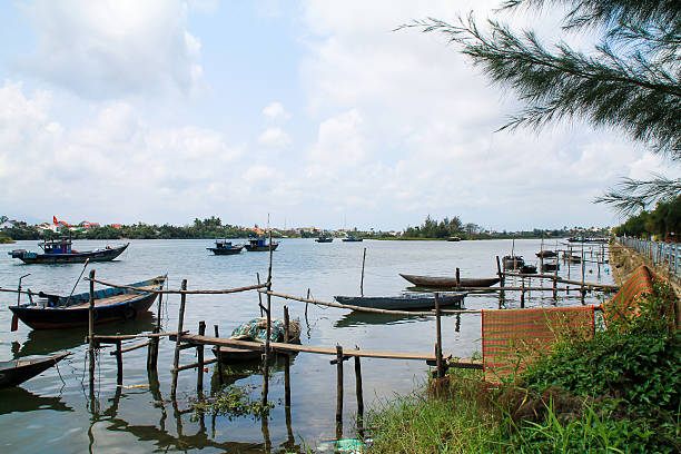 istock View over a river with old asian boats in Vietnam 541999016