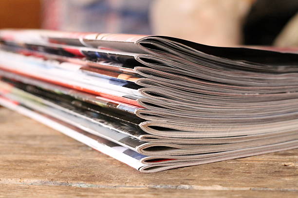 istock Magazines on the wooden table 542000610