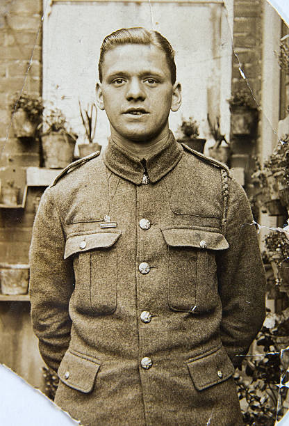 english soldier, portrait  of young man 1940th, vintage photo - askeriye fotoğraflar stok fotoğraflar ve resimler