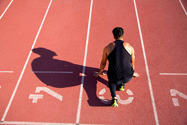 istock Young muscular man ready to start a track meet. 542002292
