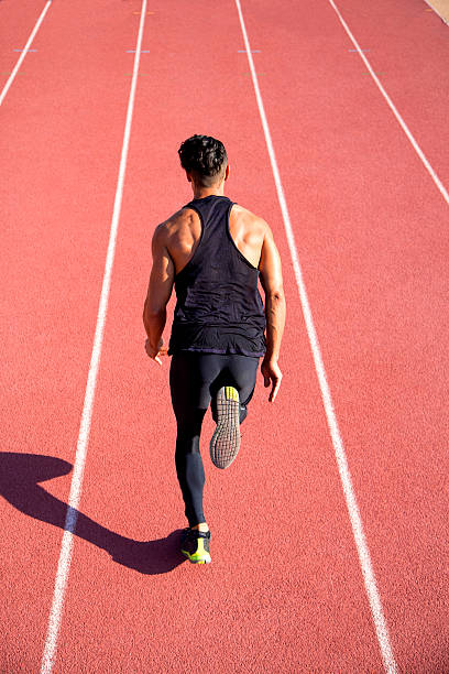 istock Young muscular man ready to start a track meet. 542002844