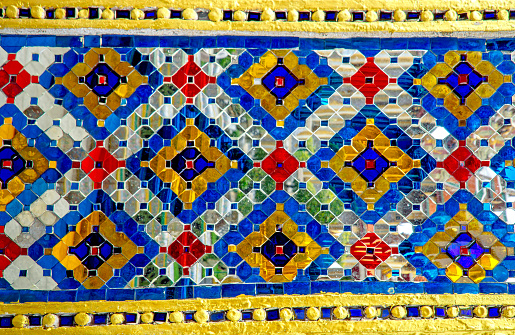 Colorful mosaic pattern at Temple of the Emerald Buddha (Wat Phra Kaew) at Bangkok, Thailand