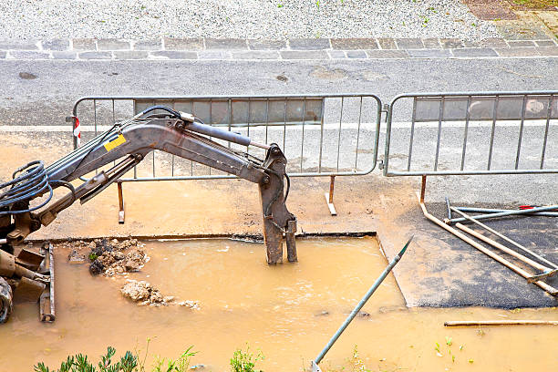 istock Excavator works to repair a water leak 542004658