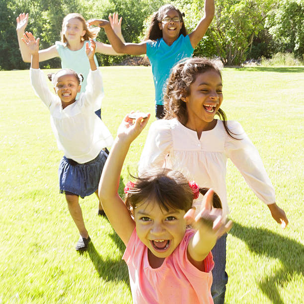 istock Children running in grassy field. 542004996
