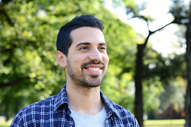 istock Close up of young man in a park. 542005120