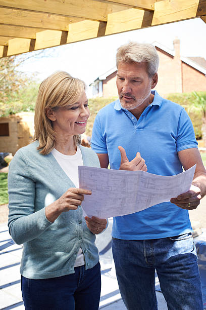 istock Mature Woman Discusses Plan With Landscape Gardener 542008616