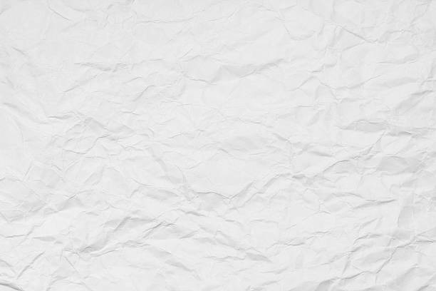 istock White paper sheet. Closeup crumpled white paper texture. 542009430