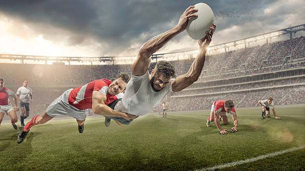 Rugby Player Tackled in Mid Air Dives To Score stock photo