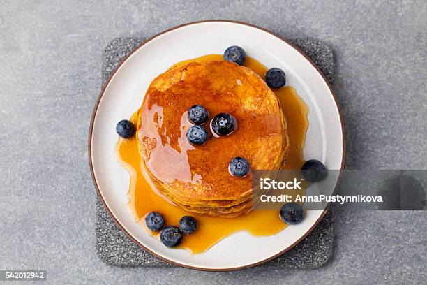 Pumpkin Pancakes With Maple Syrup And Blueberries Top View Stock Photo - Download Image Now