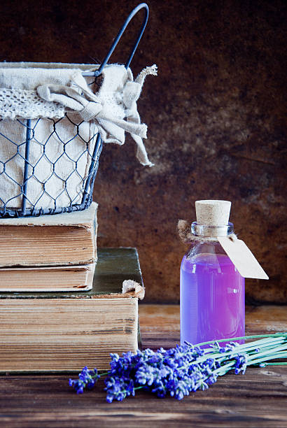 istock Lavender flowers, lavender essential and old books 542013130