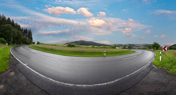 istock wet winding road in rural Eifel landscape 542013780