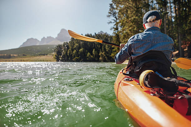 istock Man canoeing in a lake 542013856