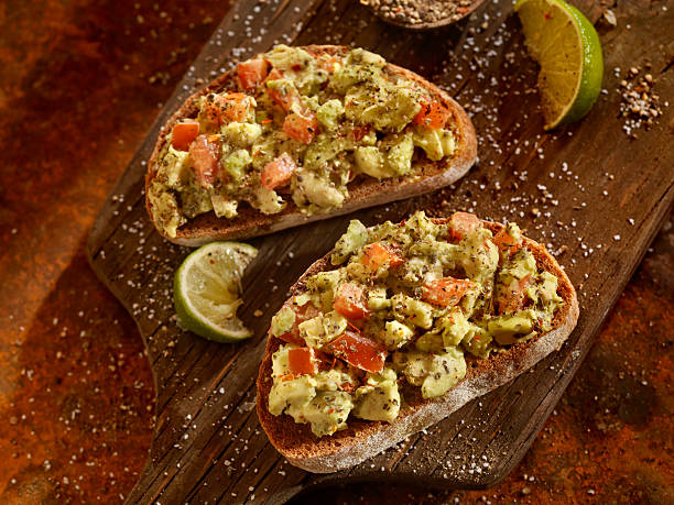 istock Avocado Toast with Tomatoes on Rye Bread 542014316