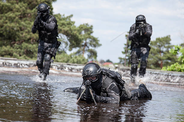 istock Spec ops police officers in the water 542014416