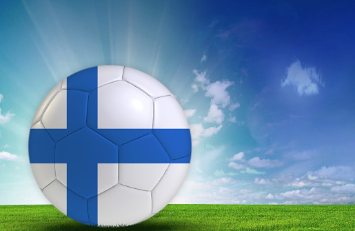 Soccer ball in nature with Finnish flag