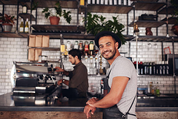 istock Happy young male coffee shop owner standing 542016702