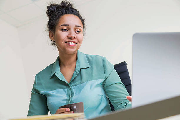 istock Smiling black girl with coffee 542066362