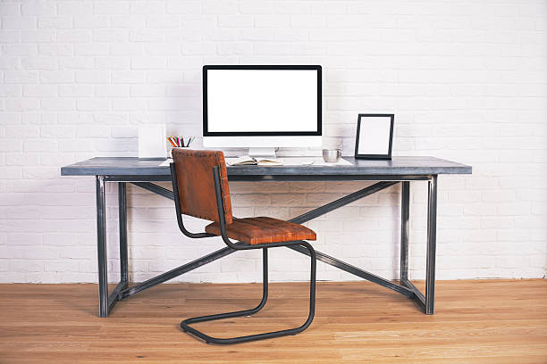 istock Desk with monitor and frames 542068322
