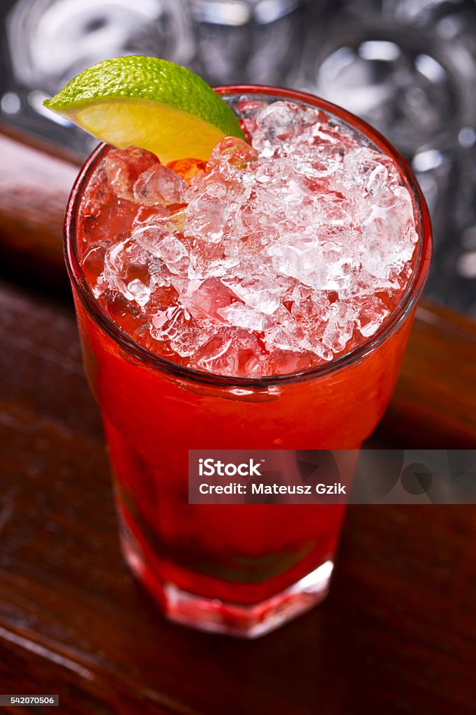 Caipiroska Cocktail Caipiroska strawberry cocktail on dark wooden bar. Alcohol - Drink Stock Photo