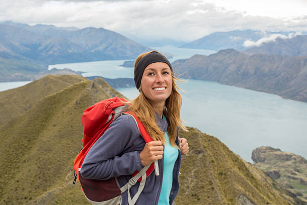 istock Cheerful hiker reaches mountain top 542071022