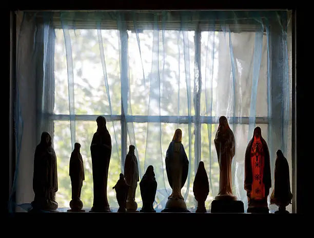 Photo of Silhouetted Virgin May Figurines