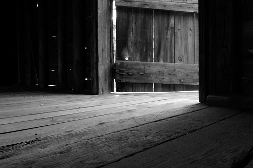 Early morning inside a restored wooden barn. 