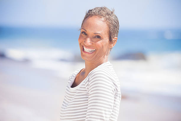 istock Senior African American Woman Smiling on Beach 542076344