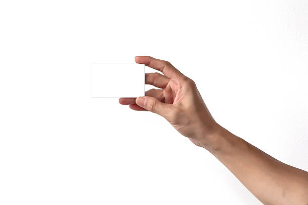 istock man hand holding blank empty credit card or business card 542077034