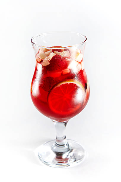 istock Red cocktail with fruits in a glass 542081530
