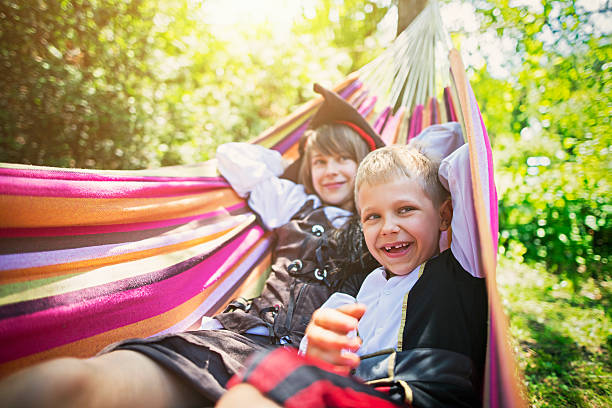 istock Kids pirates resting on hammock 542082210