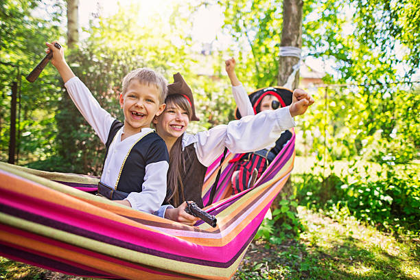 istock Three little pirates on hammock boat 542084288