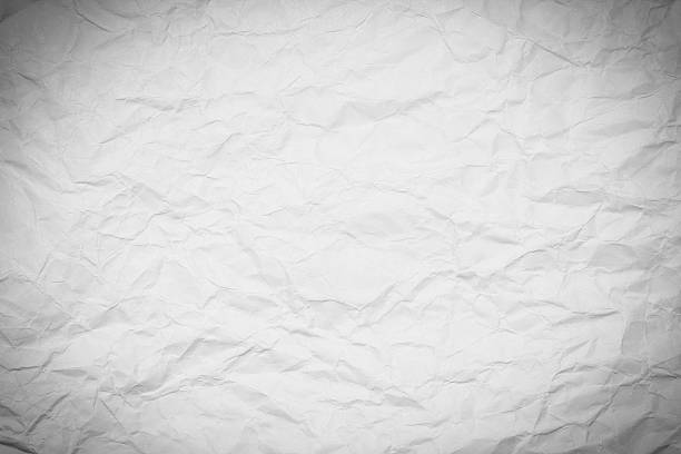 istock White paper sheet. Closeup crumpled white paper texture. 542084416