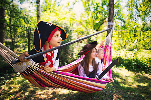 istock Kids pirates playing on hammock boat 542084696