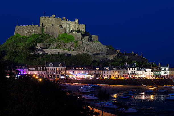 istock Gorey with Mont Orgueil Castle at night 542084886
