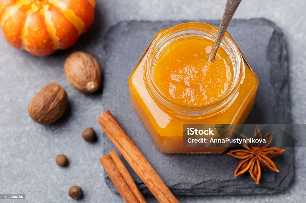 Pumpkin confiture, jam, sauce with spices Top view Pumpkin confiture, jam, sauce with spices on stone table Top view. Pumpkin Stock Photo