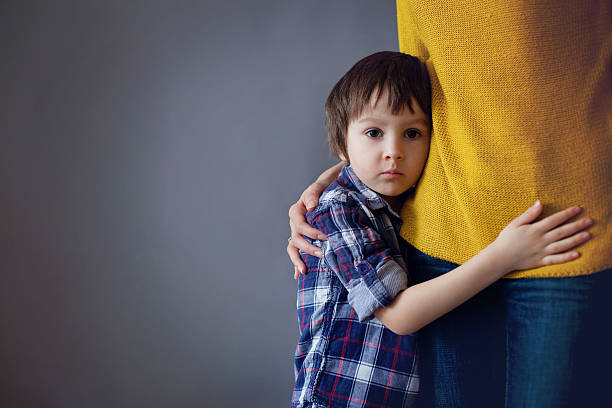 istock Sad little child, boy, hugging his mother at home 542087010