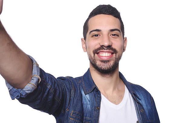 istock Portrait of young latin man taking selfie. 542087730
