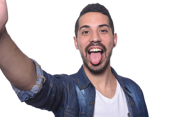 istock Portrait of young latin man taking selfie. 542087938