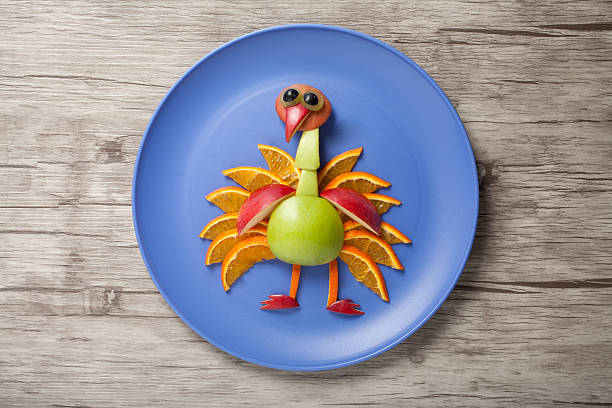 istock Funny peacock made of fruits 542089356