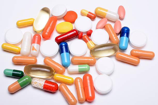 таблетки-5 - capsule vitamin pill red lecithin стоковые фото и изображения