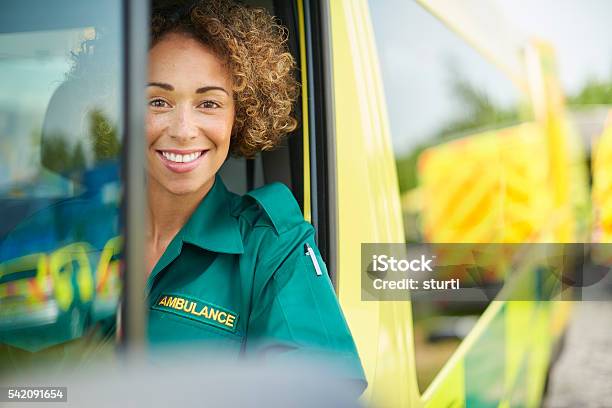 Happy Female Paramedic Stock Photo - Download Image Now - Ambulance, UK, Paramedic