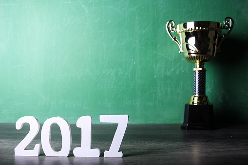 winning trophy with green calkboard background and 2017 text