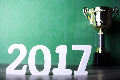 winning trophy with green calkboard background and 2017 text