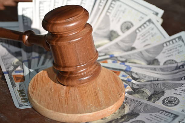 istock Wooden gavel and  US dollars 542094284
