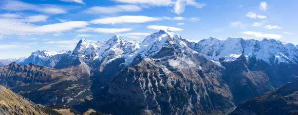 istock snow scene on alpes mountains in cloud sky 542094332