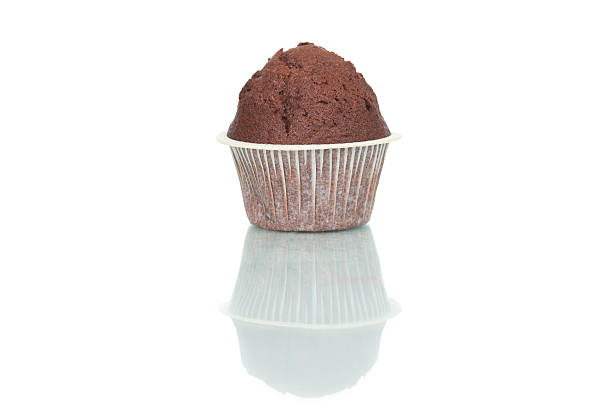 istock Chocolate muffin cake isolated on white background 542095140