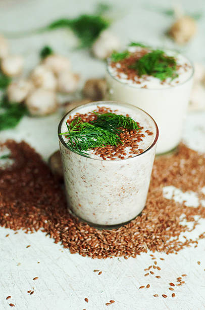 istock Glass of yogurt with crushed flax seeds 542095276