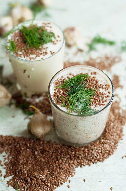 istock Glass of yogurt with crushed flax seeds 542095792